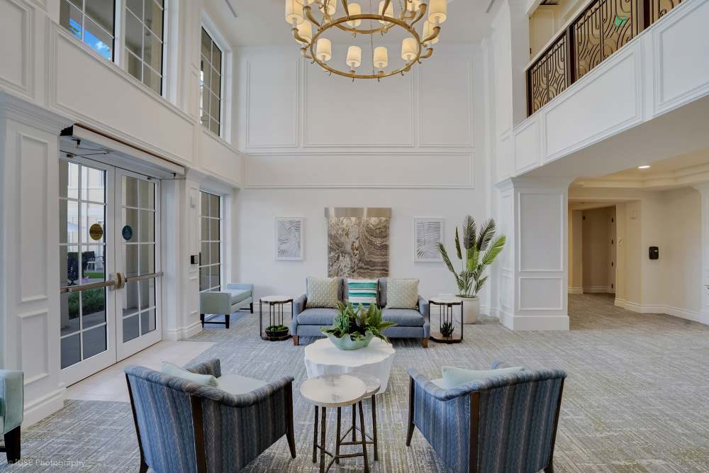 Lobby of an apartment building featuring an elegant chandelier at The Meridian at Boca Raton, Boca Raton, Florida.