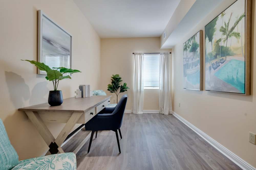 A small office featuring a desk and chair, located at The Meridian at Boca Raton in Boca Raton, Florida.