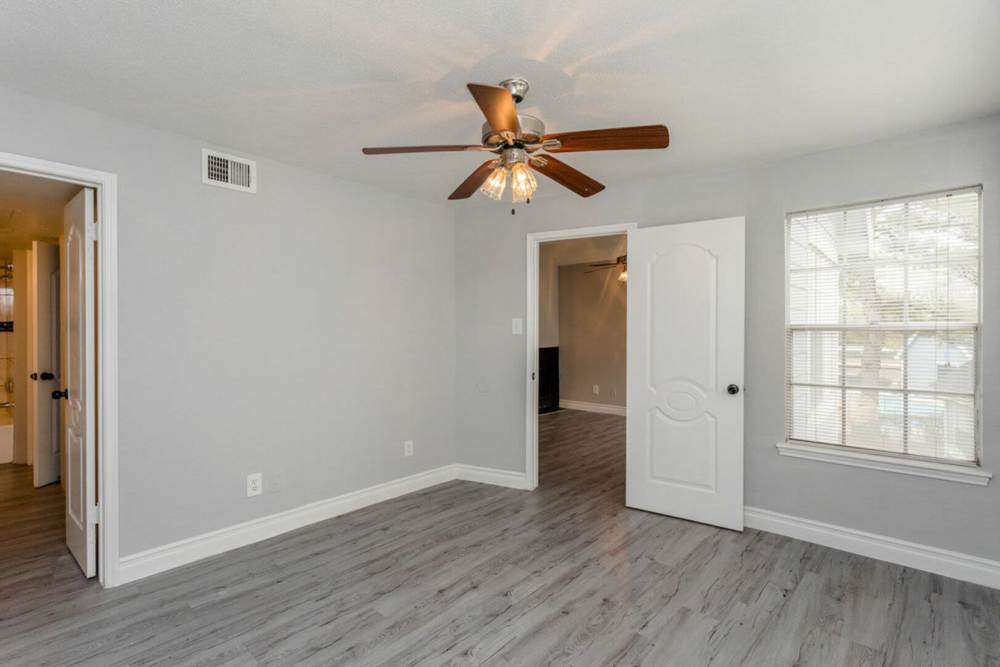Well-lit living room at Pine Lake Village in Houston, Texas