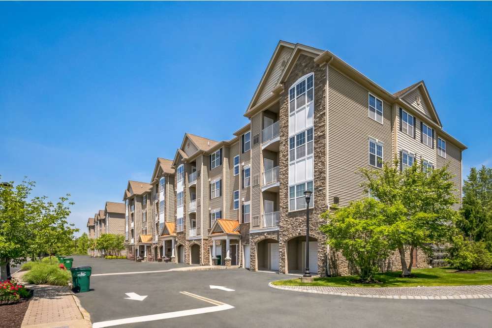 Scenic apartment complex with expansive green space and trees at Riverbend at Wappingers Falls in Wappingers Falls, New York