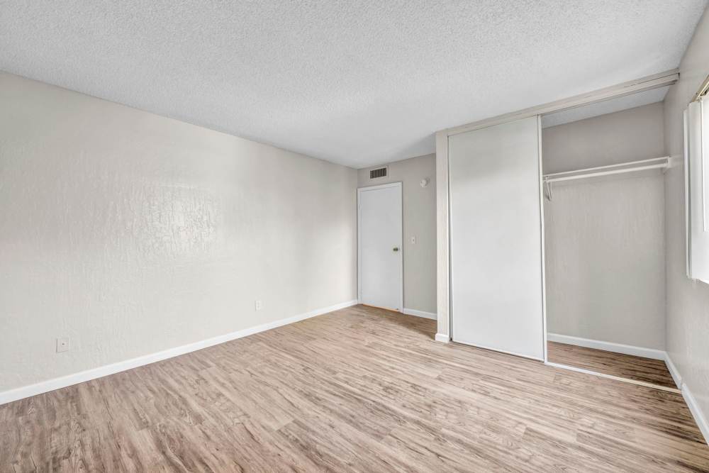 Bedroom with closet area at Riverwood Apartments in Reno, Nevada