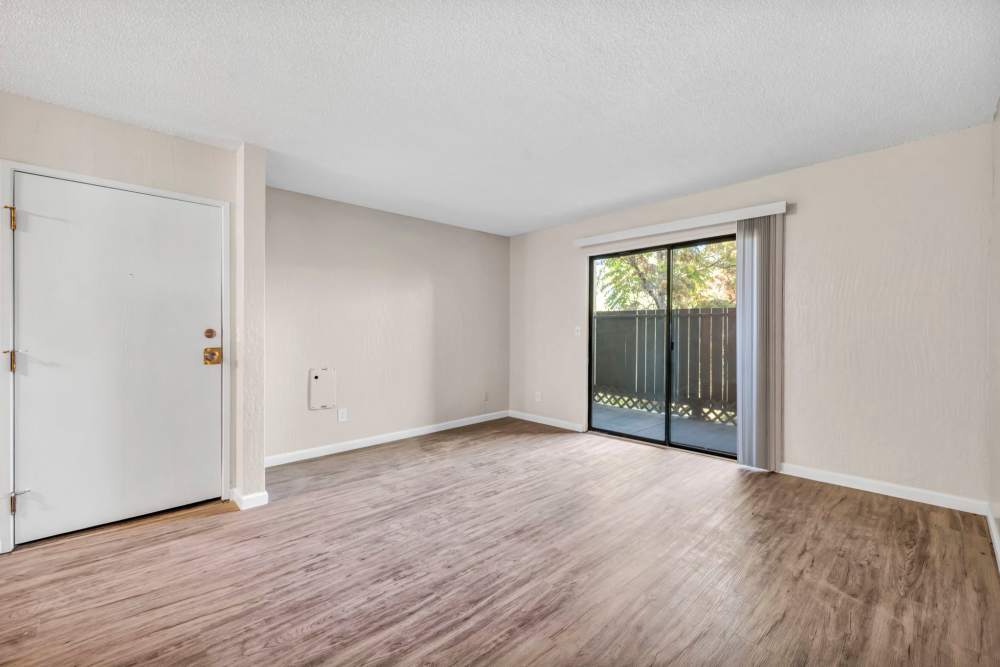 Living room with wooden flooring at Riverwood Apartments in Reno, Nevada