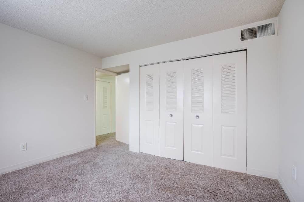 Spacious bedroom with built in cabinet at Preserve at Cradlerock Apartment Homes in Columbia, Maryland