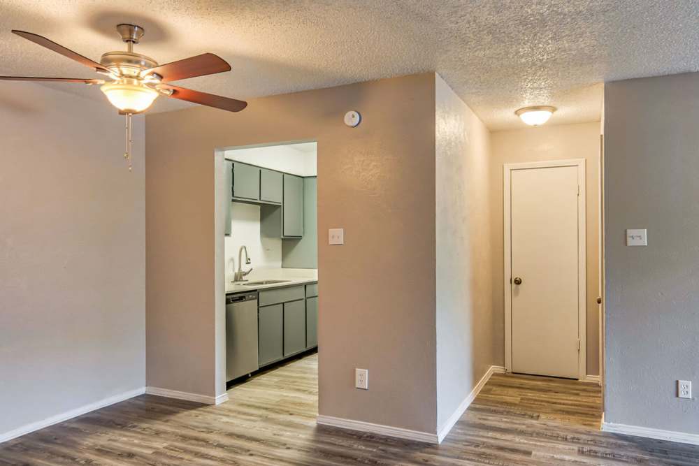 View of the kitchen from living room at Oak Manor Apartments in Henderson, Texas