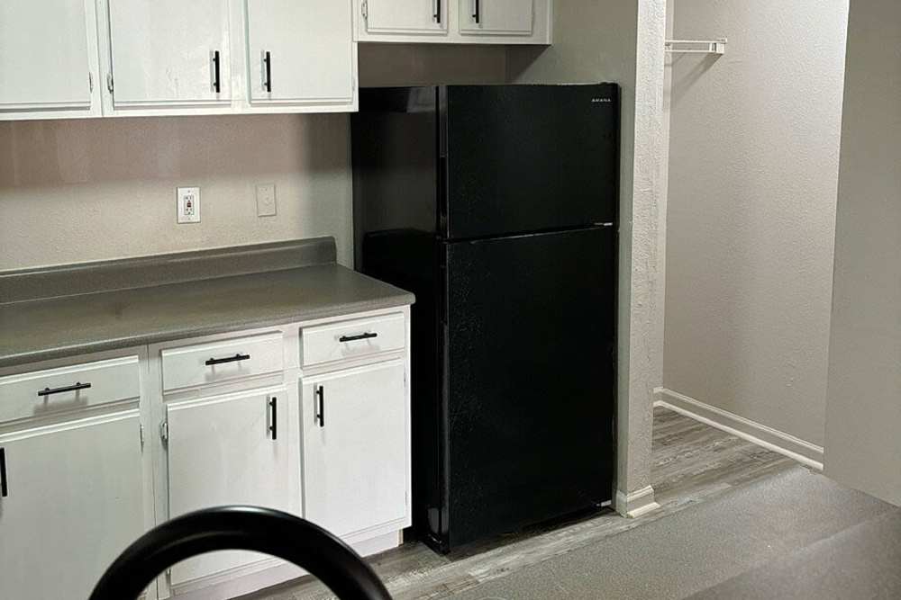 Kitchen with with wooden flooring at Steeplechase in Coweta, Oklahoma