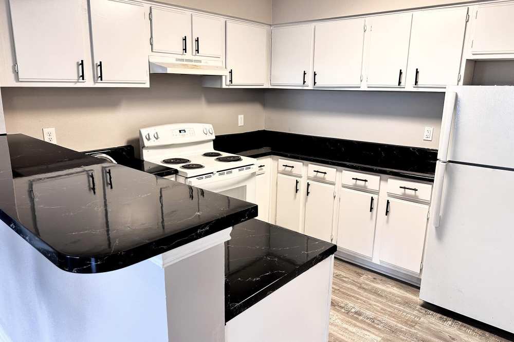 Kitchen with white color cabinet at Steeplechase in Coweta, Oklahoma