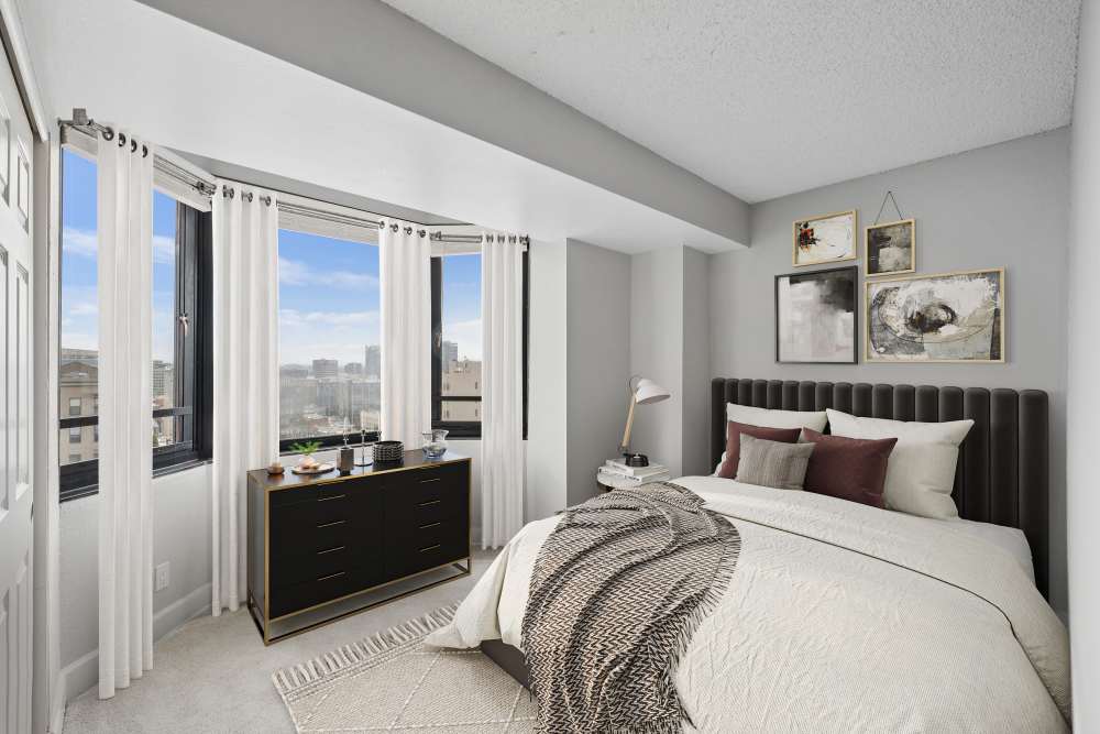 Well-furnished master bedroom in a model home at Tower 737 Condominium Rentals in San Francisco, California