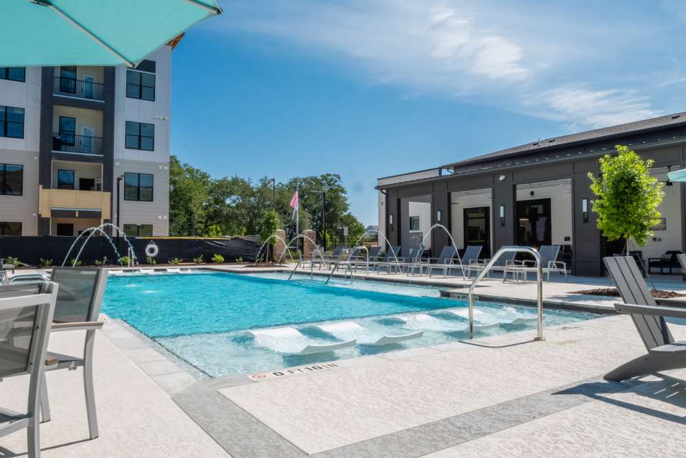 Pool Area with Lounges at The Waters at Freeport in Freeport, Florida