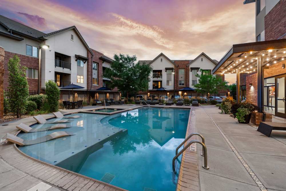 Aerial view of apartment buildings and outdoor community pool at The Parc at Greenwood Village in Greenwood Village, Colorado