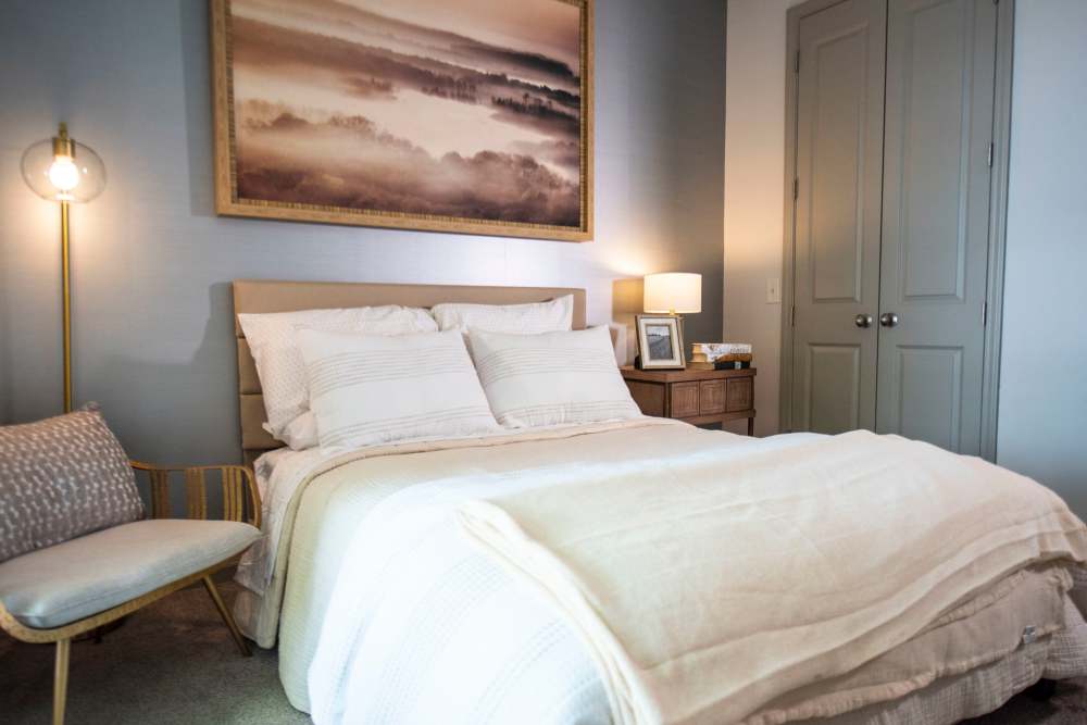 Plush carpeting and an attached bathroom in a large bedroom at The Mill at Westside in Atlanta, Georgia