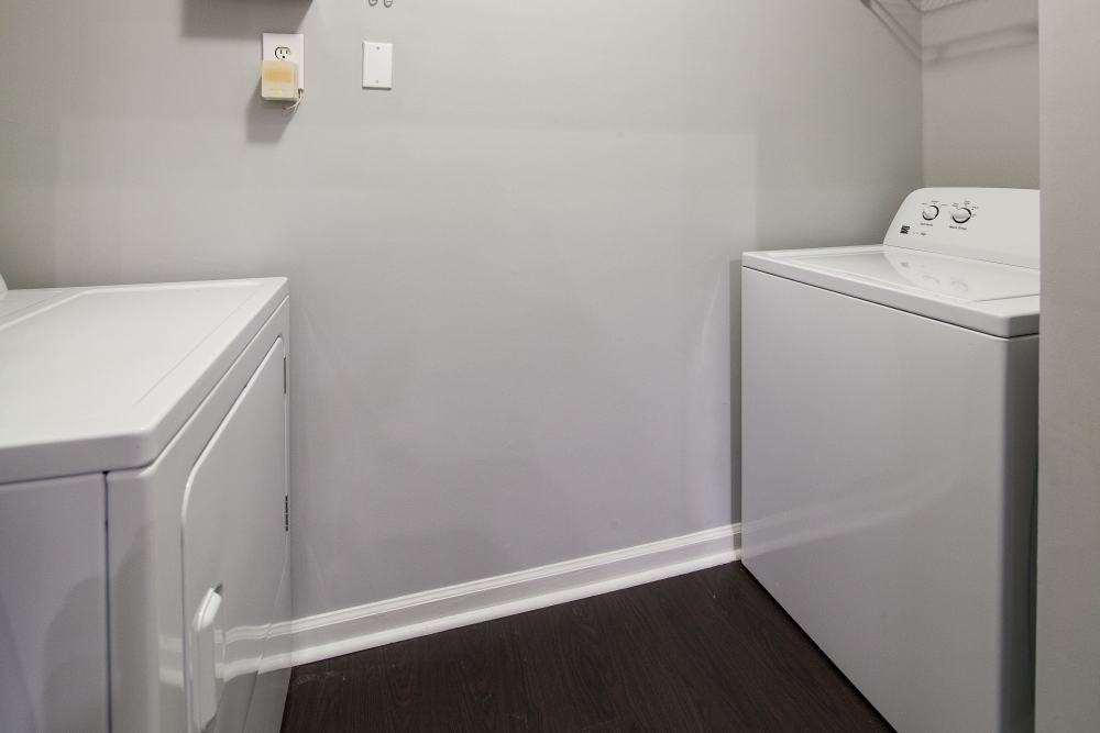 In-home laundry facility at Oaks at Sugarloaf in Lawrenceville,Georgia