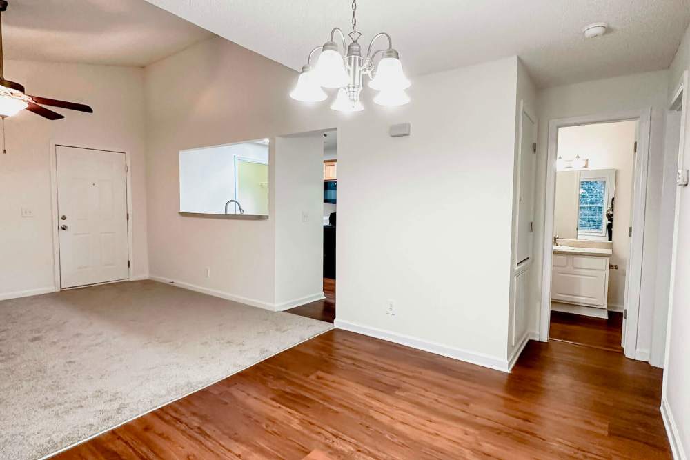 Open kitchen and living room with wood-style flooring at Orchard Trace Gastonia in Gastonia,North Carolina