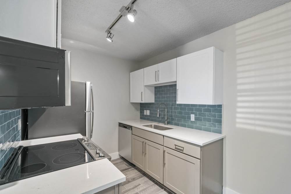 Kitchen with wooden cabinets at Forester in Charlotte, North Carolina