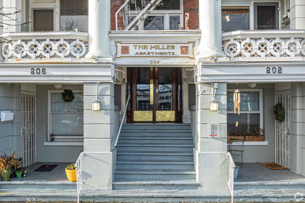 External building showcasing the balcony and entrance at The Miller in Tacoma, Washington