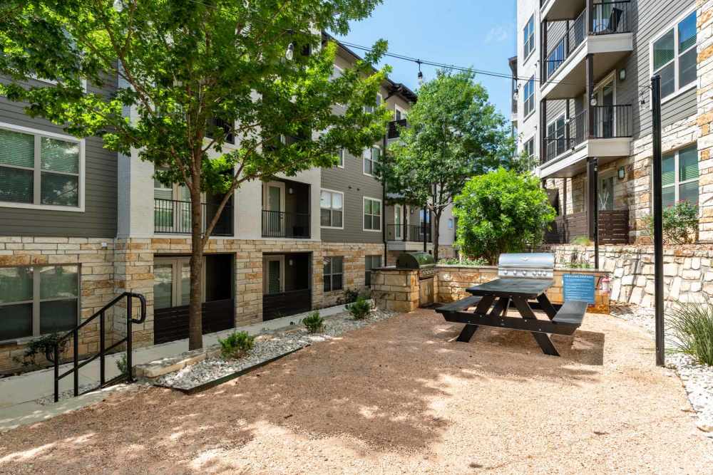 Patio area at the park in San Antonio, Texas, featuring seating and greenery for visitors to enjoy.