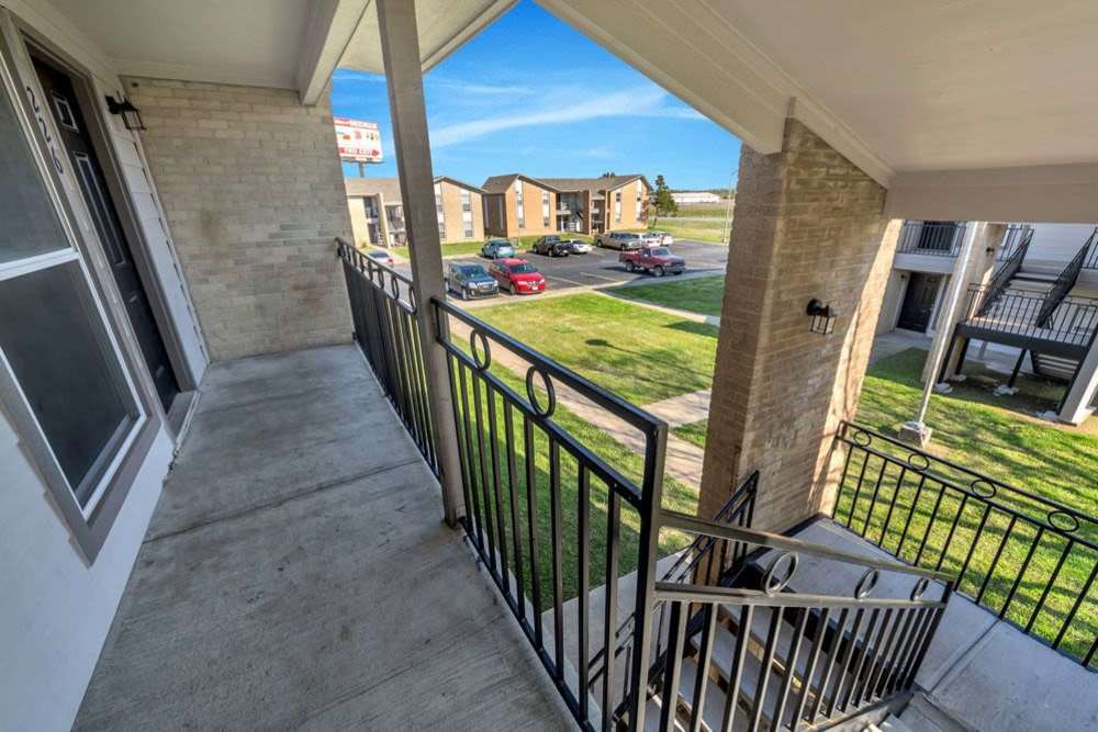 Staircase leading to the top floor at The Residence At Okemah in Okemah, Oklahoma, 