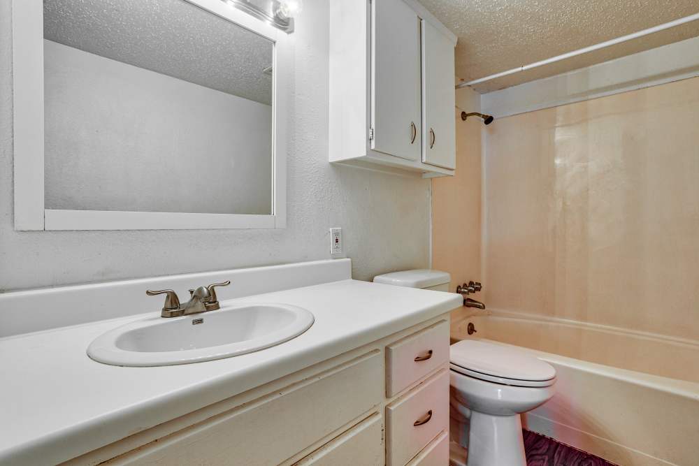 Bright bathroom with shower and bathtub at The Residence At Okemah in Okemah, Oklahoma, 