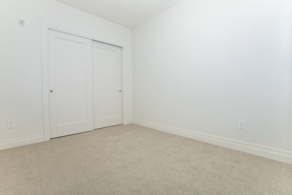 Bedroom with walk-in closet at The View at Wash Park in Denver, Colorado