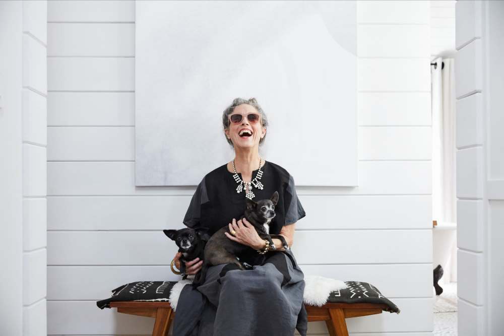 Happy resident with her dog at Encore at West Valley in White Lake, Michigan