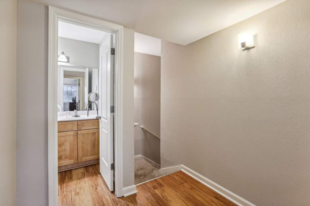 A hallway featuring a sink and toilet at 865 Bellevue Apartments in Nashville, Tennessee.