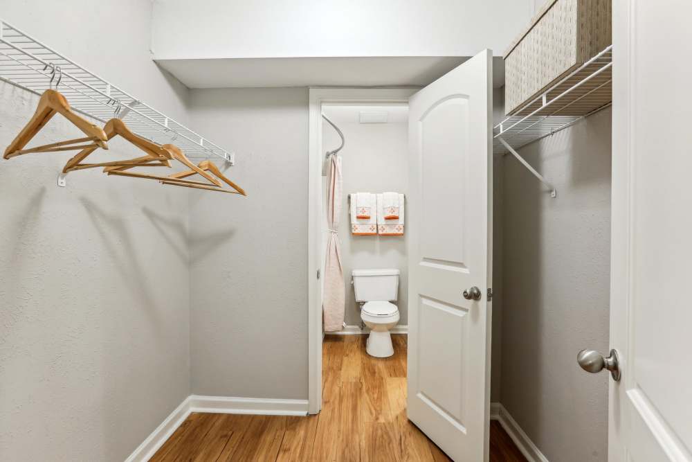 A walk-in closet featuring a toilet and shower at 865 Bellevue Apartments in Nashville, Tennessee.