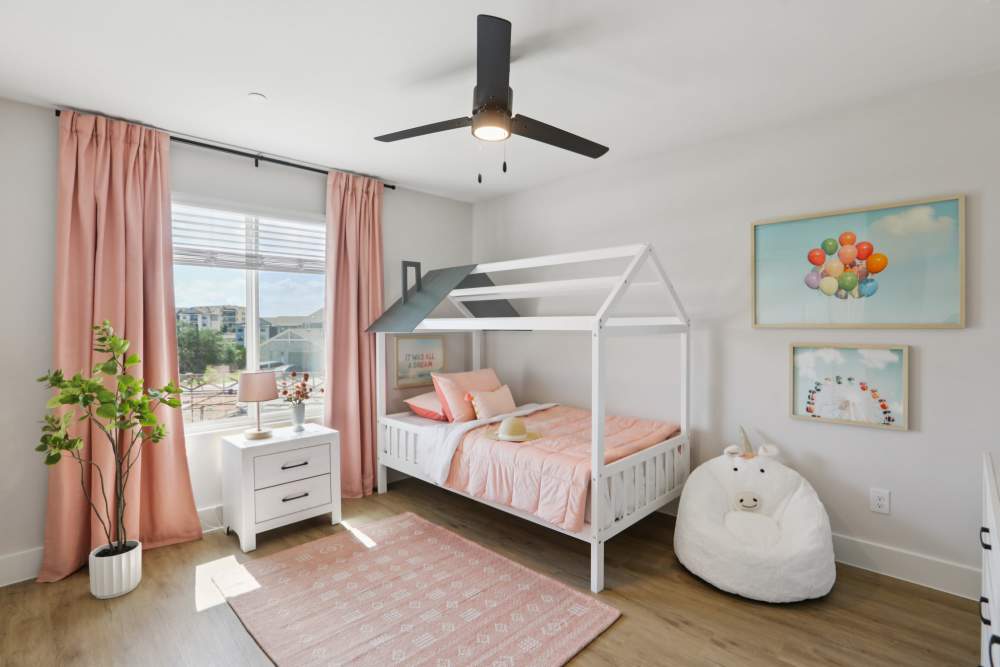 Bedroom with a comfortable bed and a ceiling fan at BB Living Sweetwater Crossing in Bee Cave, Texas