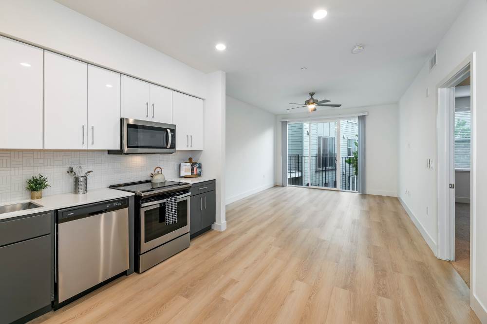 Kitchen with open living room at The Dylan