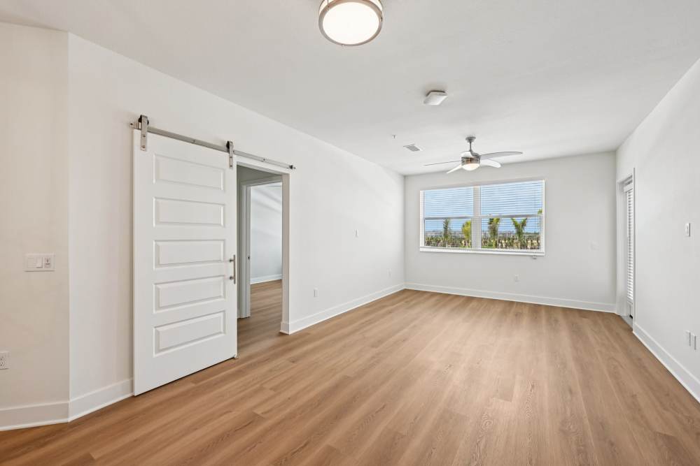 Spacious Empty Room with Large Window at The Vivien in Vero Beach, Florida
