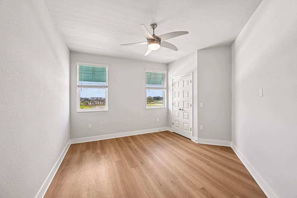 Large Empty Room with Two Windows at The Vivien in Vero Beach, Florida