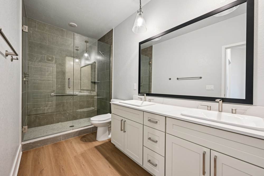 Bathroom with a Double Sink and Large Vanity at The Vivien in Vero Beach, Florida