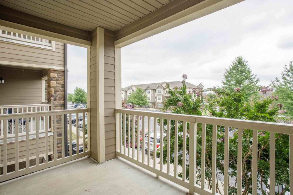Balcony view of parking lot and apartment buildings at Commonwealth at 31 in Spring Hill, Tennessee.