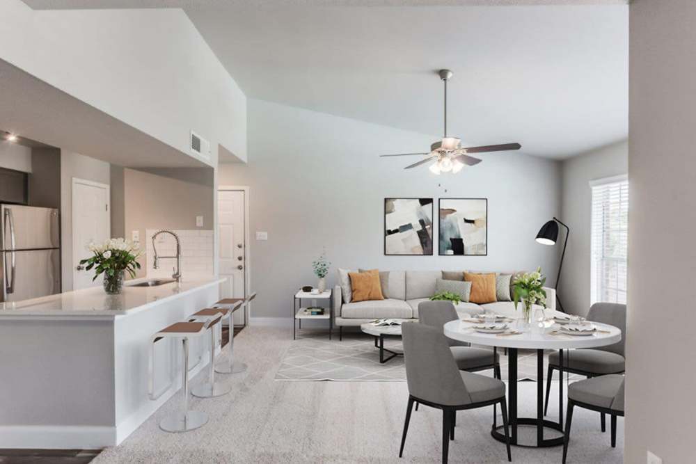 Living room with a huge ceiling fan at The Haven On Buoy in Webster, Texas