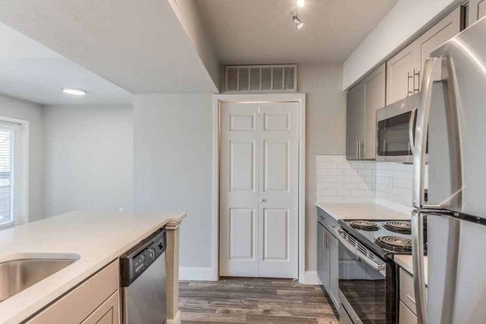 Kitchen with a refrigerator at The Haven On Buoy in Webster, Texas