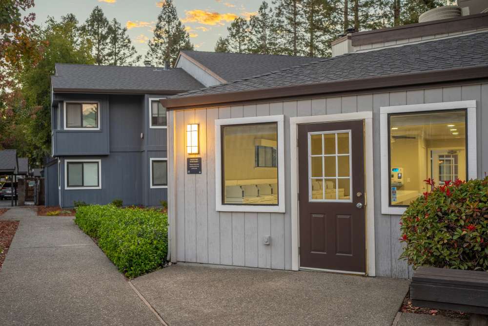 Modern building with sunset and trees around at Park Ridge Apartment Homes in Rohnert Park, California