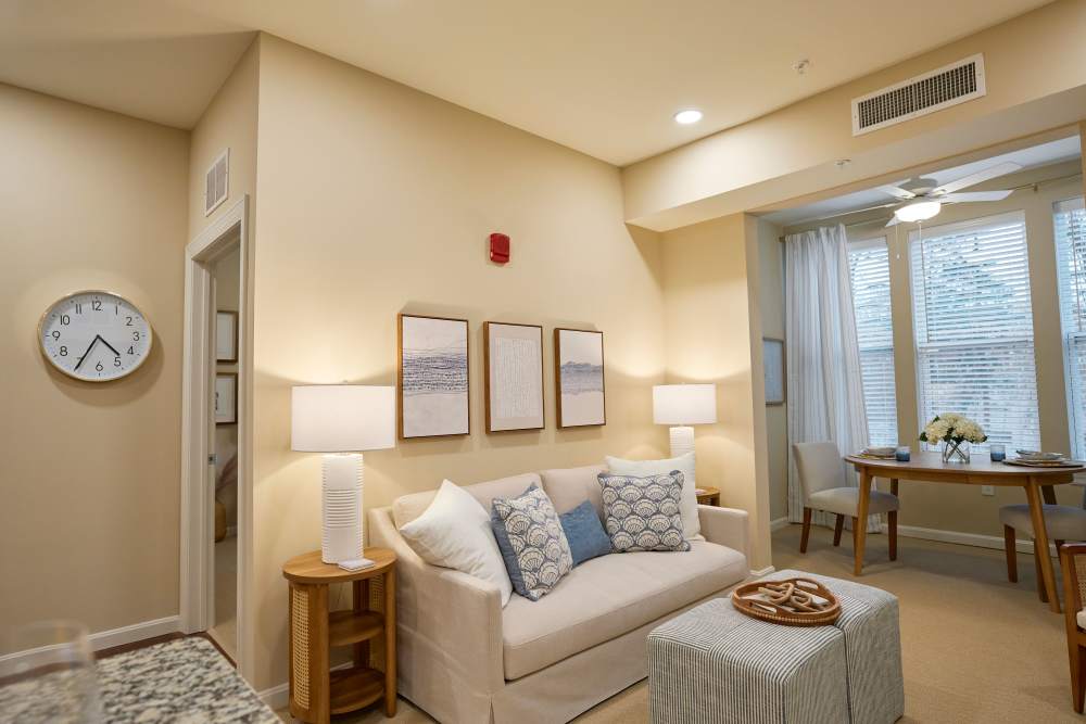 Bright living room with coffee table and couch at Harmony at Glasgow in Newark, Delaware