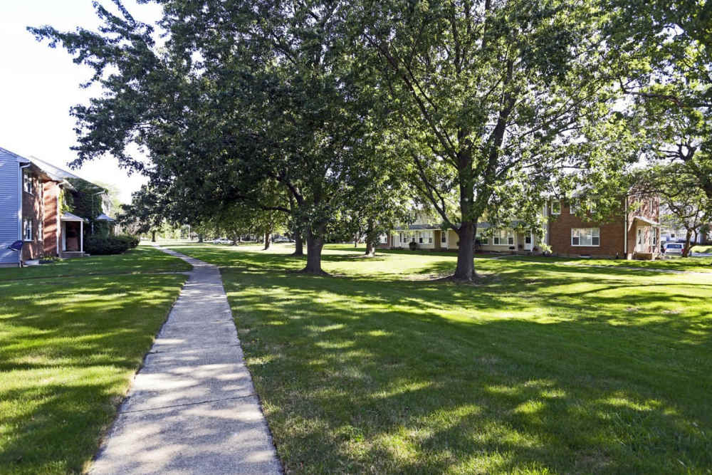 Lits of walking paths and green lawn in the welcoming neighborhood at Central Park in Park Forest, Illinois