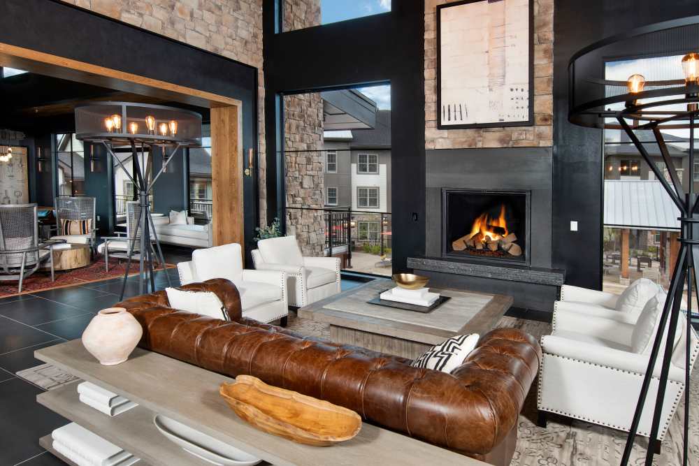 Clubhouse with fireplace and large sofa at Timberline View in Buford, Georgia