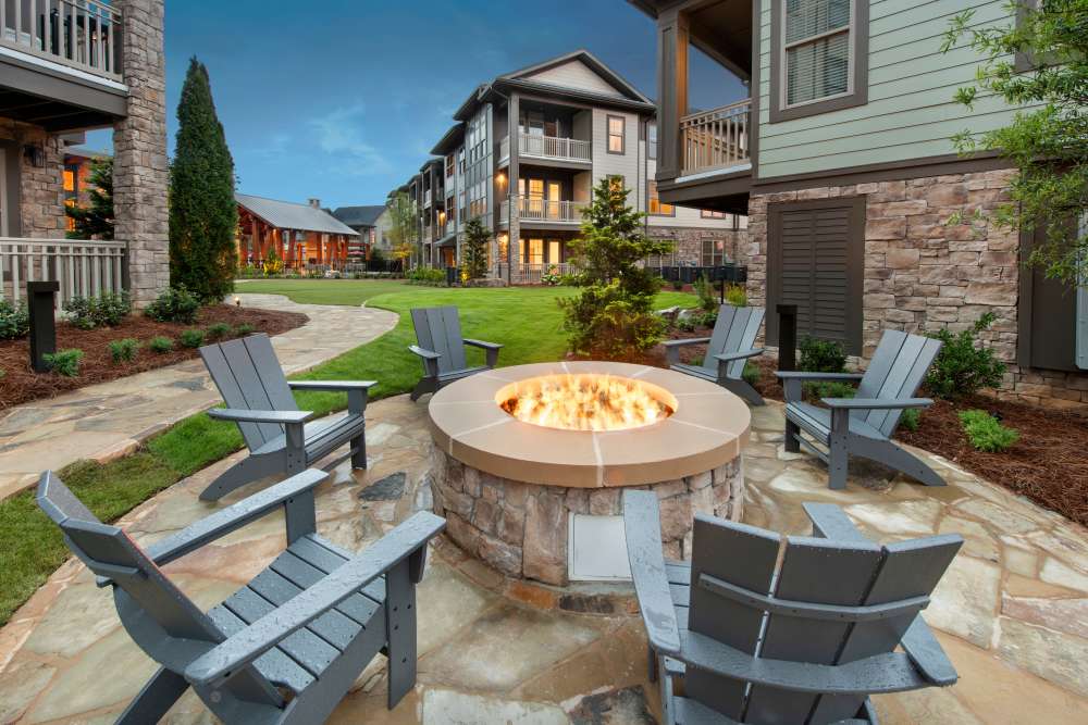 Outdoor firepit with seating area at Timberline View in Buford, Georgia