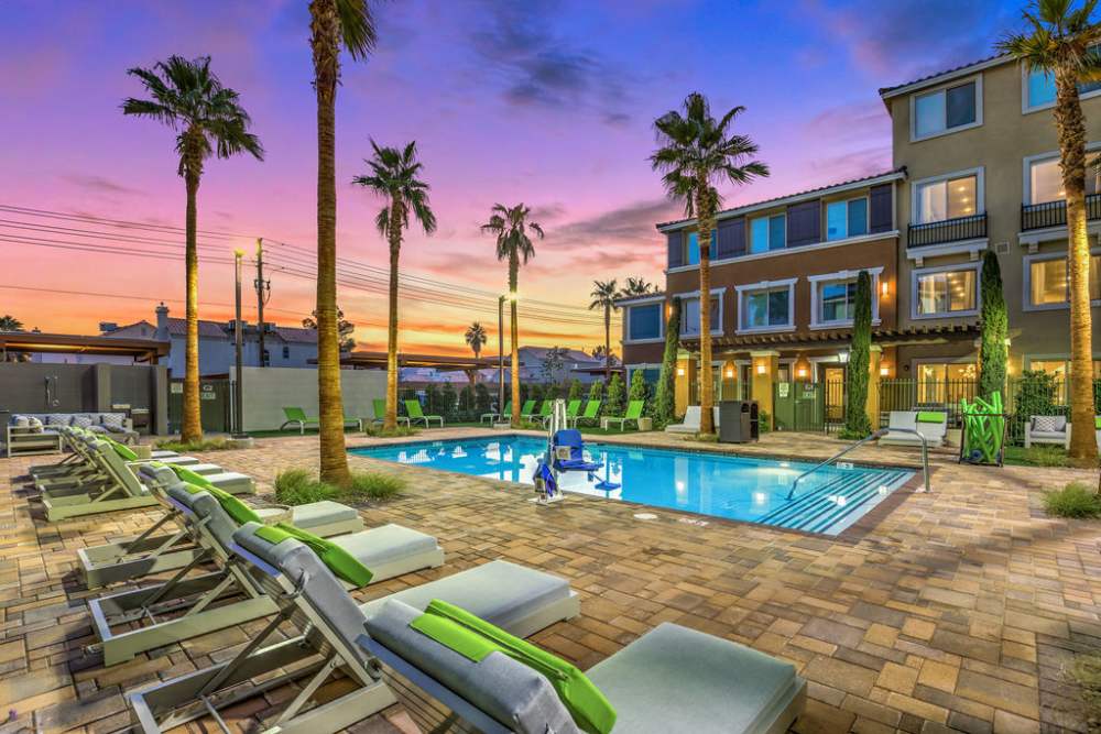 View of the poll with relaxing chairs at Harmony in Las Vegas, Nevada
