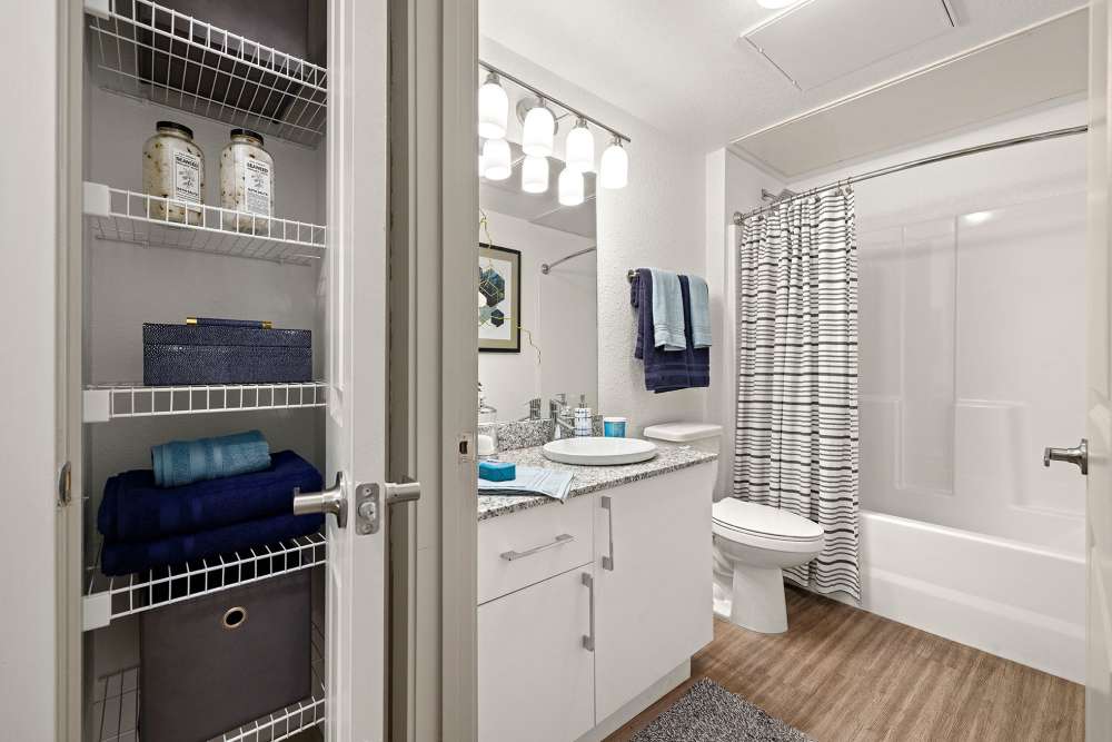 Apartment bathroom with granite counter tops at Vue on Lake Monroe in Sanford, Florida