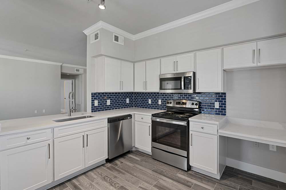 Kitchen with wood-style flooring at Lyndon in Houston,Texas