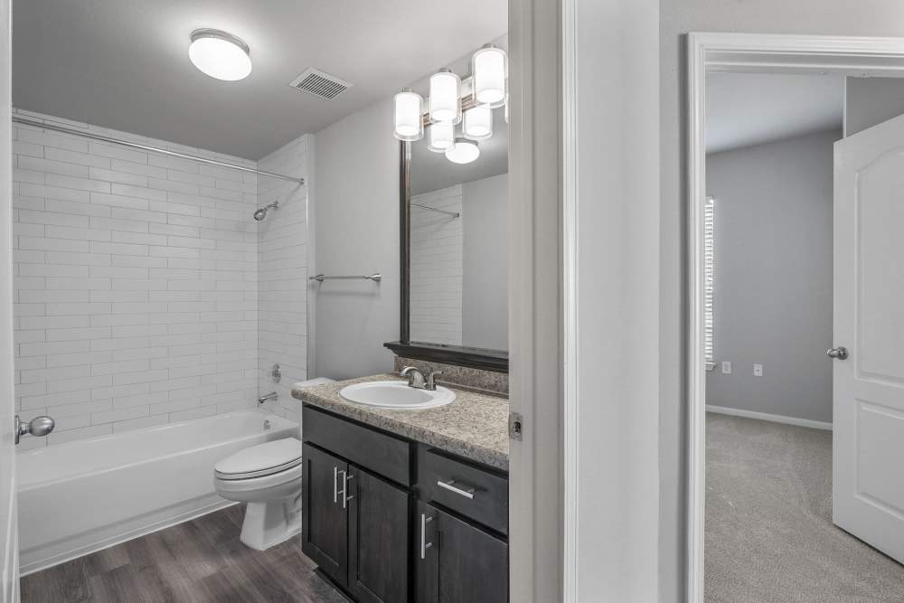 Bright bathroom with pendant lighting at Lyndon in Houston,Texas