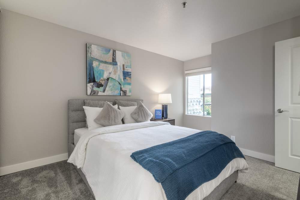 Cozy bedroom to rest in at Gateway Apartments in San Leandro, California