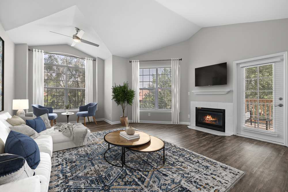 Oversized, remodeled living room with reading nook at Isabella Apartment Homes in Greenwood Village, Colorado