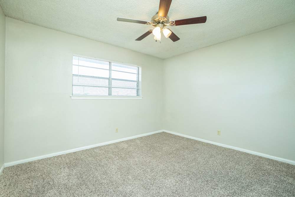Bedroom with a window at Gold Talon in Universal City, Texas