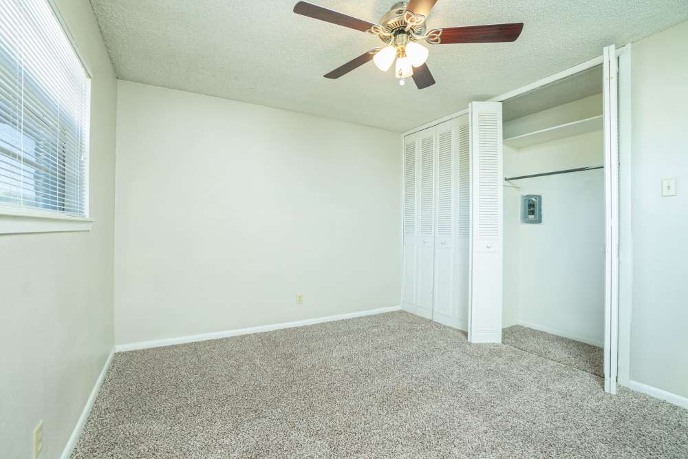 Bedroom with a walk-in closet at Gold Talon in Universal City, Texas