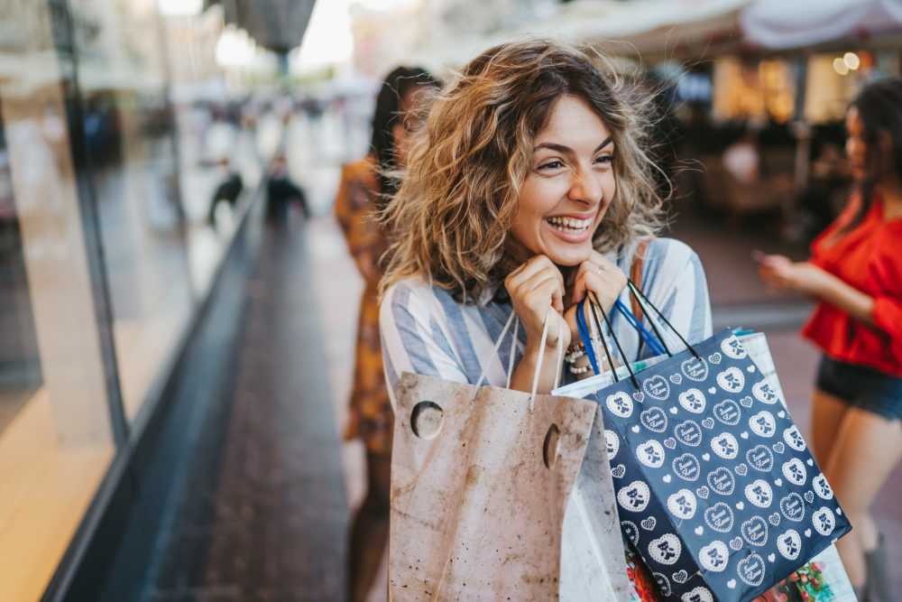 A happy resident woman shopping near Park Terrace Apartment Homes in Muskegon,Michigan