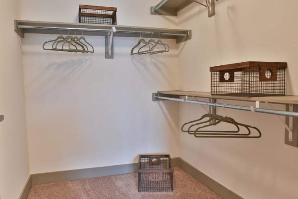 Spacious closet with metal shelving and organized storage bins at Alcove at Alamo Heights in San Antonio, Texas