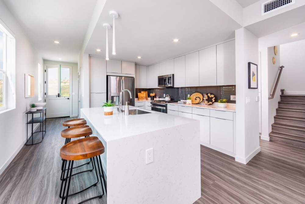 Expansive kitchen with an island and stainless-steel appliances at Marea in Dana Point, California