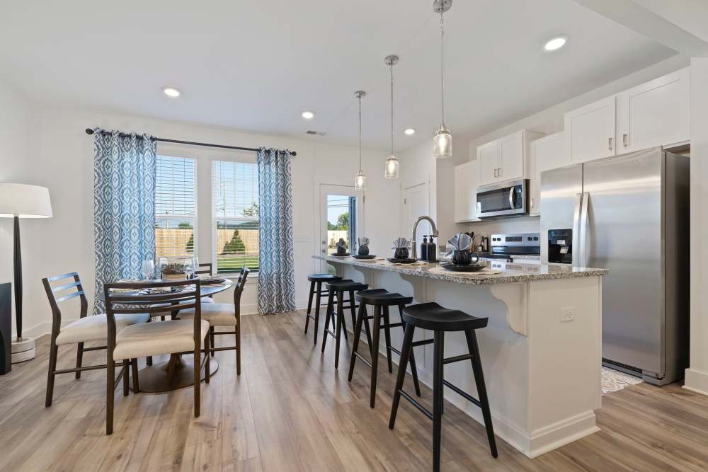 Bright kitchen and dining area at Artisan Living Mills River in Mills River, North Carolina